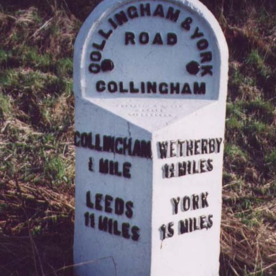 Milestone, about 250m N of A659 jct