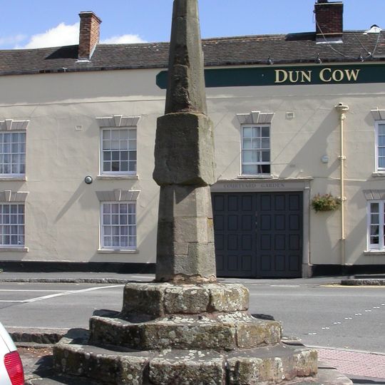 Milestone, opp."The Dun Cow" PH at crossroads with A426