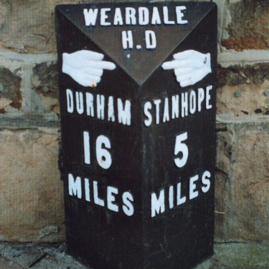 Milestone In Front Of Number 12