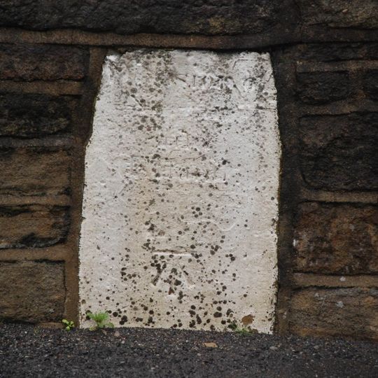 Boundary stone in eastern parapet of bridge at junction with Turbury Lane