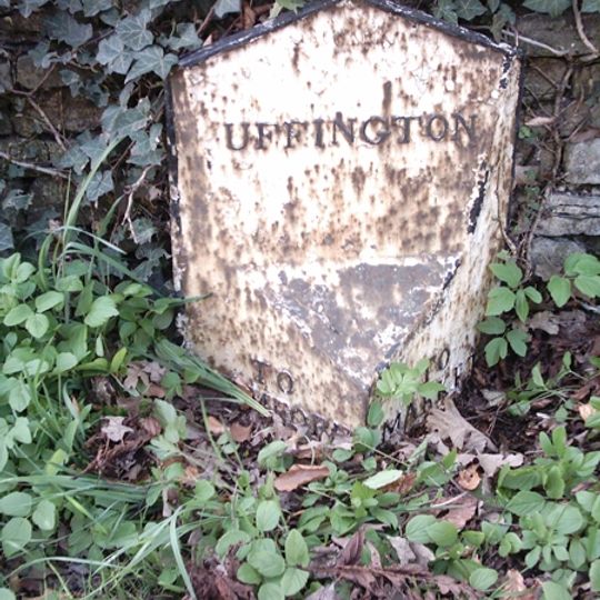 Milepost In Centre Of Village