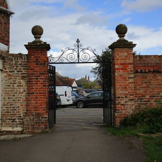 Brick Wall With Gateway Attached To Cottage At The Vicarage