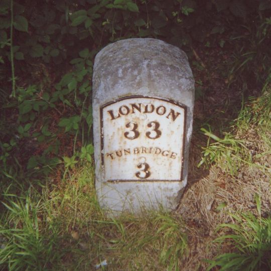 Milestone, N end of village green, opp. jct with Church Road, nr college and school