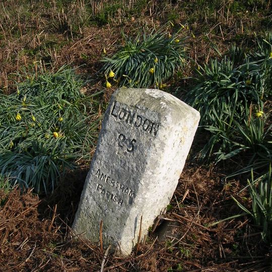Milestone, London Road East; SE of Bury End Roundabout, beyond houses, 25m before Gas Compound