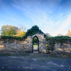 Garden wall and porches attached to front of Colan Barton Farmhouse