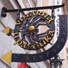 Emblem of "U pavouka" wine bar