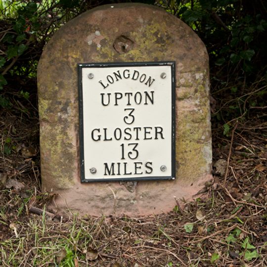 Milestone, by "LONGDON" sign, N end of village