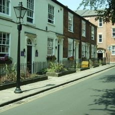 Gas Lamp Post On Pavement Between Numbers 21 And 22