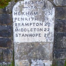 Milestone Set Into Rounded Corner Of Wall To West Of Town Hall