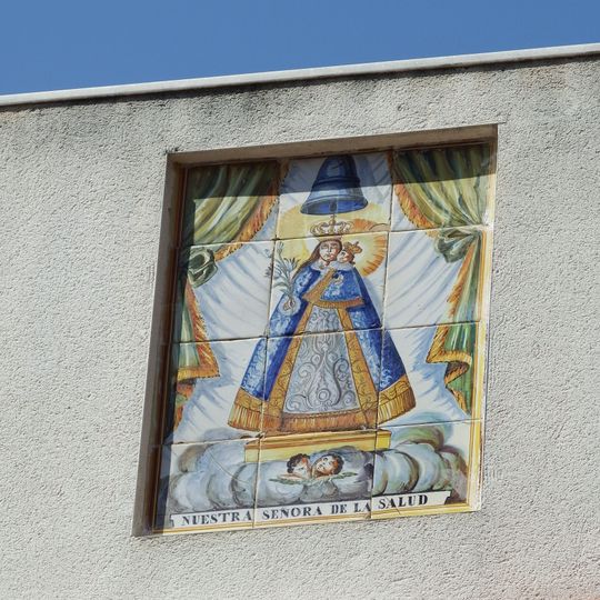 Ceramic panel of Our Lady of Good Health at Joan Carles I street
