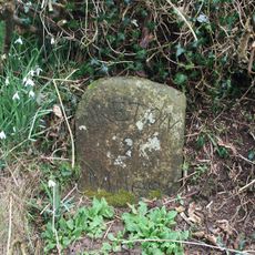 Milestone, Five Oaks, on an old loop of the road opp. New Road Estate, at Folly gate