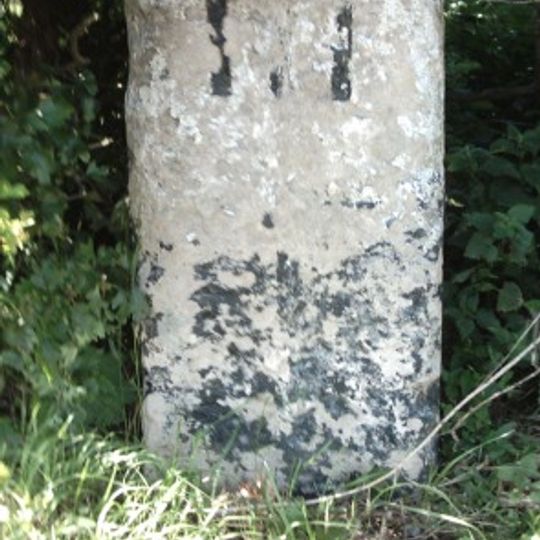 Milestone, Newmarket Road, W of Greenhouse Farm, nr airport